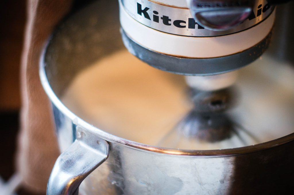 perspective shot of a Kitchenaid mixer mixing butter