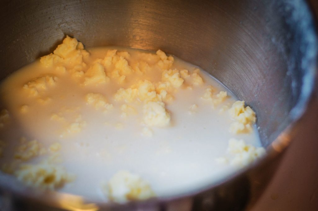 butter forming from liquid in a pot