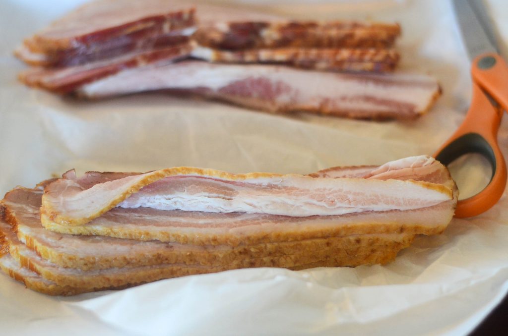 strips of uncooked homemade bacon