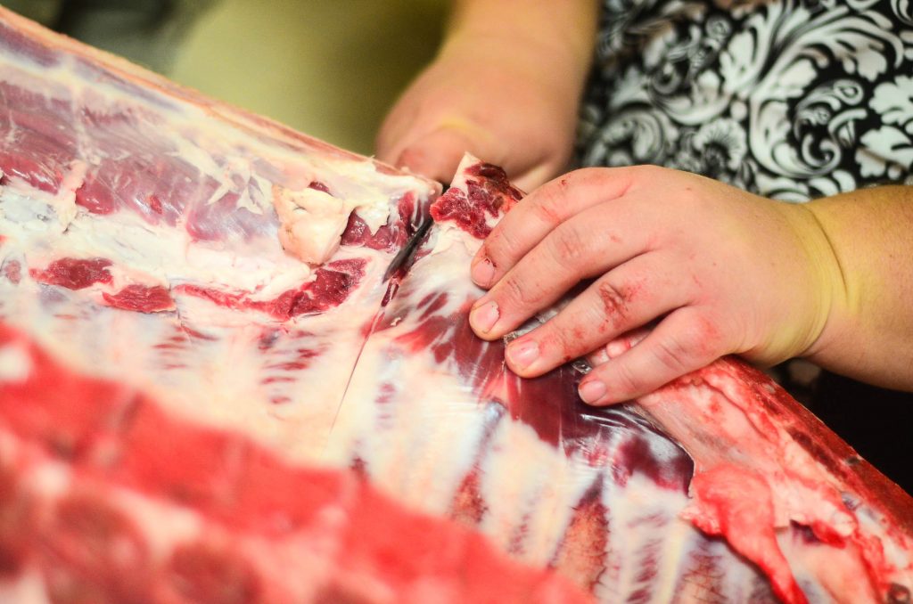 Butchering a Pig: Holly helping with butchering | The Elliott Homestead