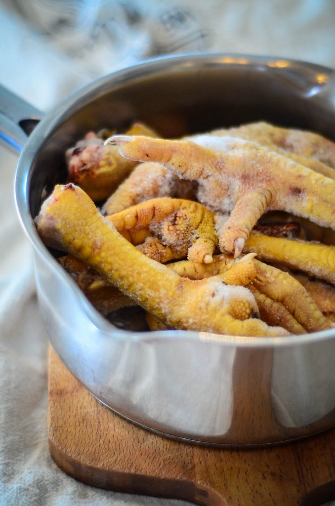 Step 1: Place the chicken feet into a saucepan